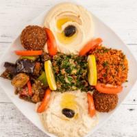 Appetizer Combo Starter · Hummus, baba ganoush, tzatziki, falafel and tahini sauce for an additional charge.