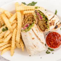 Falafel Wrap · wrapped in lavash lettuce tomatoes pickles and tahini sauce.