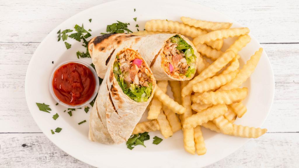 Chicken Shawarma · Wrap includes onion, tomato, cucumber, hummus and turnip, tahini, wrapped in tortilla or lavash bread.