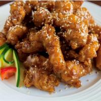 Sesame Chicken        芝麻鸡 · Chicken breast deep-fried with chef's special sauce and sesame seeds.