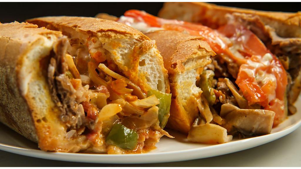 Cajun Cheesesteak · Thinly sliced fresh grilled steak layered with sweet grilled onions, Cajun seasoning and cheddar cheese sauce on a fresh French roll.