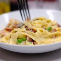 Carbonara · With chicken, bacon, and peas in alfredo cream sauce.
