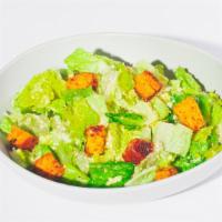 Caesar Salad · Fresh romaine, housemade croutons & Parmesan cheese served with Caesar dressing.