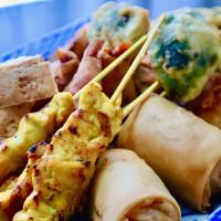 Dusita's Sampler · Combination of satay chicken, Thai rolls (vegetables), prawn rolls, mixed vegetable tempura ...