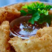 Golden Calamari · Crispy deep-fried calamari batter, served with spicy sweet and sour dipping sauce.