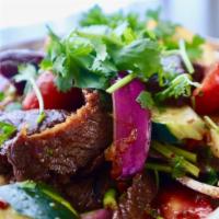 Grilled Beef Salad · Grilled beef slices mixed with lettuce, tomato, cucumber, yellow onion, red onion, seasoned ...