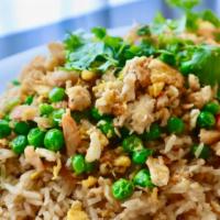 Crab Fried Rice · Pan-fried rice with crab meat, egg green onion and green peas.