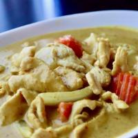 Yellow Curry · Yellow curry paste in coconut milk prepared with carrots, yellow onion and potato.