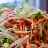 Green Papaya Salad (Som Tum) · Fine shredded green papaya, tomato, green beans and peanuts, seasoned with thai chili and li...
