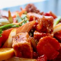 Spicy Tofu & Mixed Vegetables · Soft-fried tofu sautéed with garlic, mushrooms, bell peppers, baby corns, carrots, yellow on...