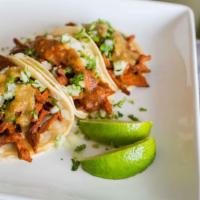 Vegan Street Taco · Corn tortillas, vegan meat, cilantro, onions, and salsa.