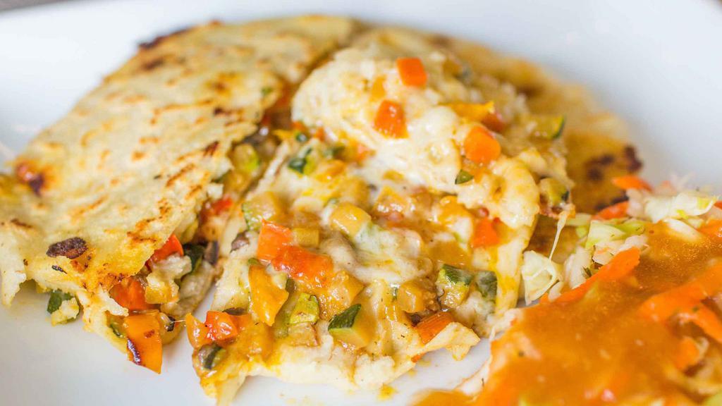 Veggie Pupusa · Corn flour dough with stuffed cheese, pre-mixed vegetables (grilled carrots, zucchini, bell peppers, onions, and mushrooms).