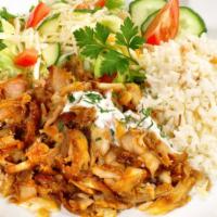 The Chicken Shawarma Plate · Freshly sliced chicken shawarma bedded on steamed rice and customer's choice of side.