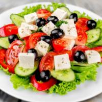 Greek Salad · Greek excellence! Romaine lettuce, tomatoes, onions, green peppers, cucumbers, kalamata oliv...