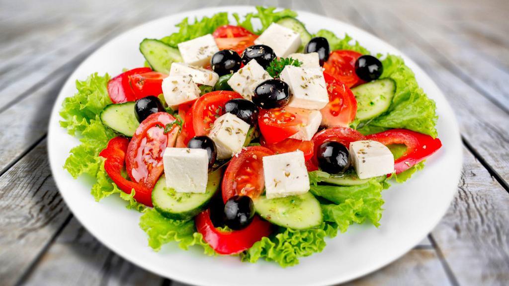Greek Salad · Greek excellence! Romaine lettuce, tomatoes, onions, green peppers, cucumbers, kalamata olives, feta cheese and balsamic vinaigrette dressing.