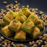 Walnut Baklava · Buttery dough soaked in honey and sugar and stuffed with tender pieces of walnut.