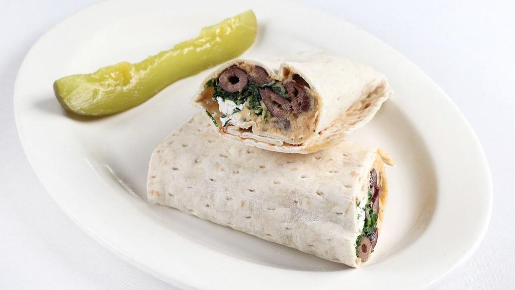 Mediterranean · Falafel, hummus mixed with fresh herbs, feta cheese, and Mediterranean olives wrapped in lavash bread.