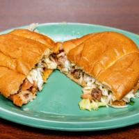 Super Tortas · Choice of meat, cilantro, onions, hot or mild sauce, sour cream, cheese, lettuce.
