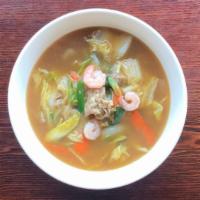 Umani Ramen · Noodles in soysauce flavored soup, topped with shrimp, pork and vegetables cooked in thick b...