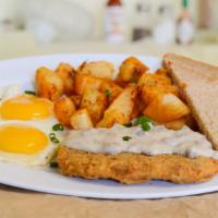 A6. Country Fried Steak · Fried steak smothered in sausage country gravy, two eggs any style, choice of potatoes and s...