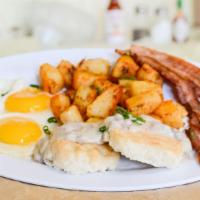 A5. Big Country Breakfast · Choice of 3 bacon strips, 3 sausage links or grilled ham, two eggs any style biscuits smothe...