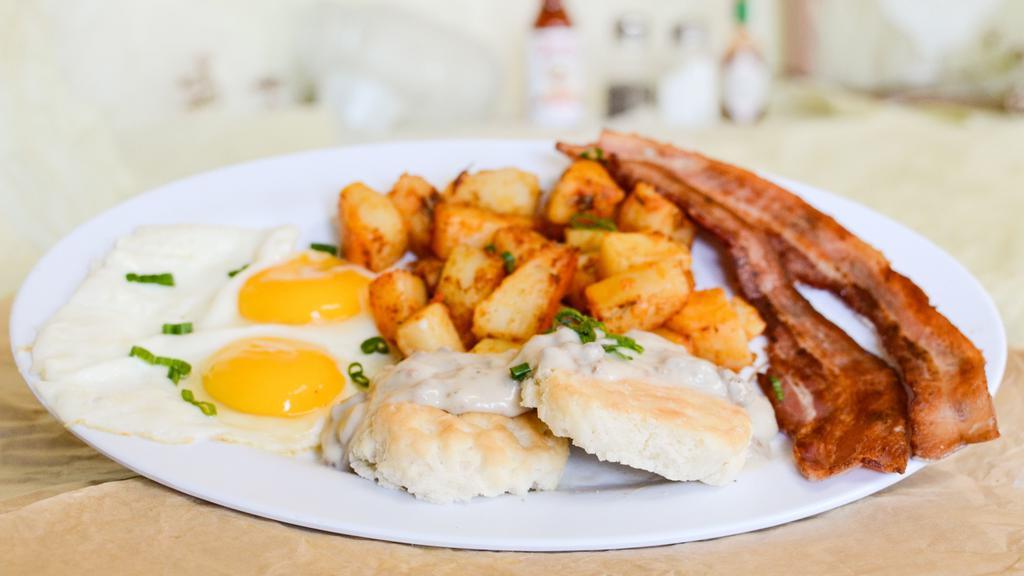A5. Big Country Breakfast · Choice of 3 bacon strips, 3 sausage links or grilled ham, two eggs any style biscuits smothered with sausage gravy.