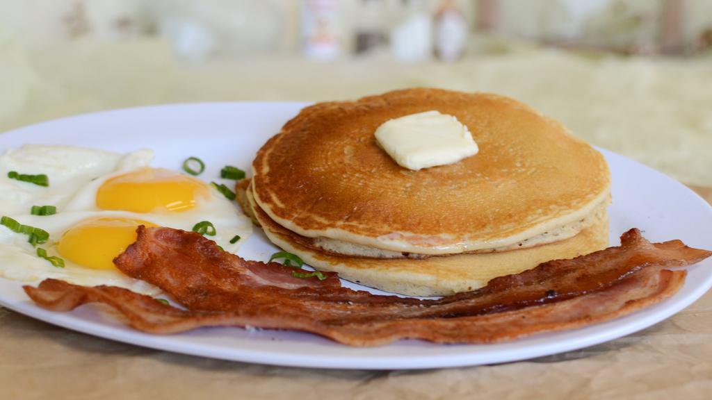 A2. Delight Special · Two ﬂuffy pancakes, choice of 2 sausage links, 2 bacon or grill ham and one egg any style.