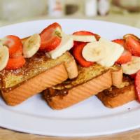 D6. Strawberry & Banana · Two buttermilk pancakes or three thick slices of French toast, topped with fresh strawberry,...