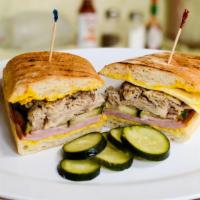 F10. Cuban · Smoked pork shoulder, ham, pickles, mustard and Swiss cheese on panini roll.