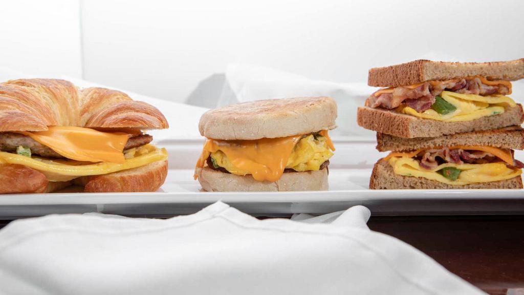 Egg Melt Sandwich (Regular) · Egg, Cheese, Emil's Sweet Sauce and your choice of Meat; Bacon, Ham, Country sausage or Turkey sausage on your Choice of Bread Sourdough, Wheat, White, Rye, English muffin, Brioche Bun, Croissant or Bagel