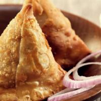Samosa Pair · Two savory spicy samosas served with our signature chutneys