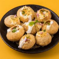 Dahi Puri · Popular Indian street chaat made by stuffing crispy puffed puris with boiled potatoes and to...