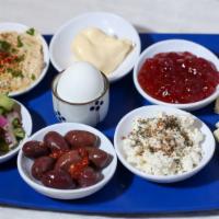 Turkish Style Breakfast · Boiled egg, slice tomato, cucumber, feta cheese, kalamata olives, butter, and jam with pita ...