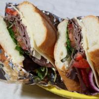 Roast Beef · Served with mayonnaise mustard lettuce tomatoes red onion and pickles.