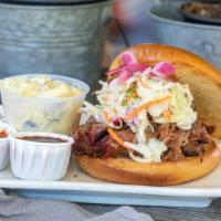Award Winning Pulled Pork · Slow Smoked Pulled Pork, Coleslaw, Pickled Red Onion on a Brioche Bun
