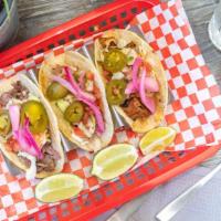 BBQ Tacos · 3 Tacos, Corn Tortilla,  Filled with your choice of bbq meat, Slaw, Jalapeno, Pickled Red On...