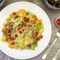 BBQ Chicken Caesar · Grilled chicken breast, hearts of romaine, parmesan cheese, croutons, side of caesar dressing.