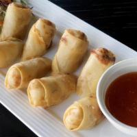 A09. Egg Rolls · Deep fried vegetarian egg rolls stuffed with silver noodle, black mushroom, carrot, and cabb...