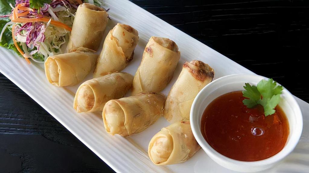 A09. Egg Rolls · Deep fried vegetarian egg rolls stuffed with silver noodle, black mushroom, carrot, and cabbage served with sweet and sour sauce.