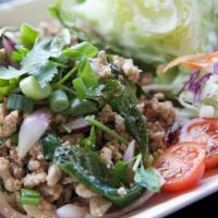 A02. Larb · Your choice of ground chicken, ground pork or ground beef cooked with red and green onions, ...