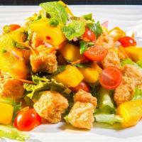 A04. Mango Salmon · Deep fried salmon, mango, cashew nut, and onions in spicy lime dressing served with sliced c...