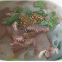 B11. BBQ Pork Noodle Soup · Noodle with BBQ pork, Chinese sausage and yao choy in clear broth.