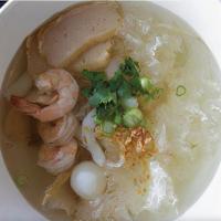 B12. Seafood Noodle Soup · Noodle with shrimps, calamari, fish balls, sliced fish cakes, scallop, white fungus and bean...