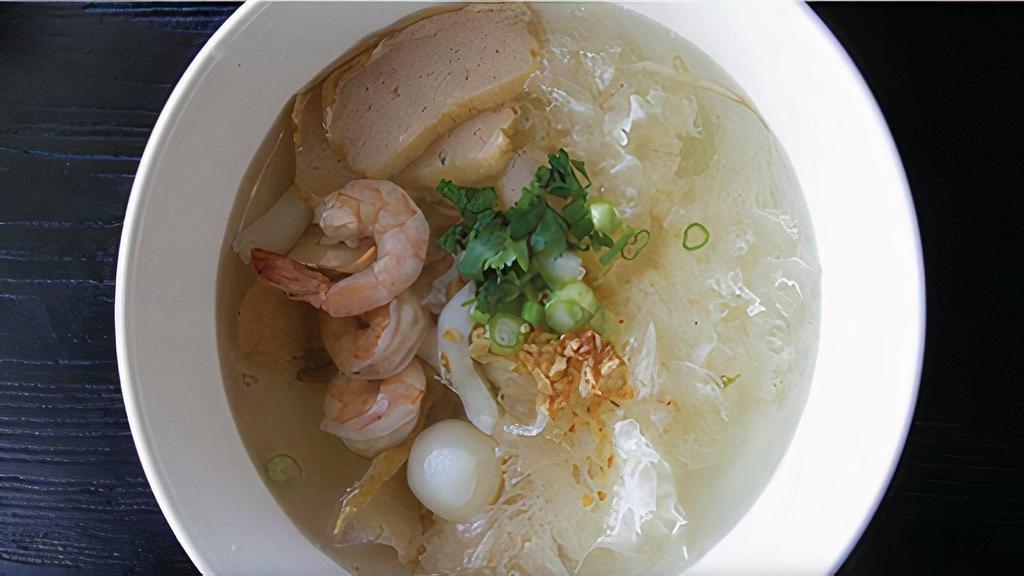 B12. Seafood Noodle Soup · Noodle with shrimps, calamari, fish balls, sliced fish cakes, scallop, white fungus and bean sprout in clear broth.