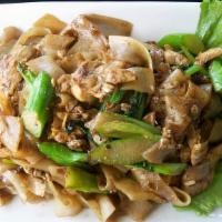 C02. Pad See-Ew Noodle · Stir-fried flat rice noodle and your choice of meat with egg, Chinese broccoli in sweet blac...