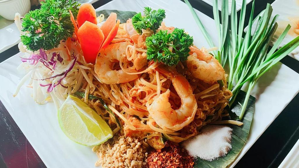 C01. Pad Thai Noodle · Stir-fried thin rice noodle, shrimps, dry shrimps, egg, ground peanut, tofu and bean sprout with red paprika powder and lime juice.