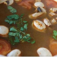 D07. Tom Yum Goong · Thai style hot and sour soup with shrimps, mushroom, tomato, galanga, lemongrass, and cilant...