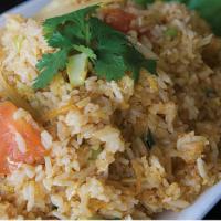 E06. Thai Style Fried Rice · Fried rice with your choice of meat, egg, white onion, green onion and tomato topped with ci...