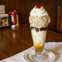 Black & Tan · Toasted almond and vanilla ice creams layered with caramel and hot fudge toppings. Topped wi...