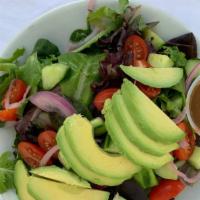 Kahlo Salad · Spring mix with tomatoes, onions, and avocado tossed in a raspberry balsamic dressing.